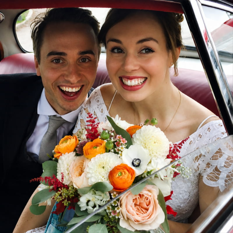 Bride with wedding flowers by Allium in Stow-on-the-Wold