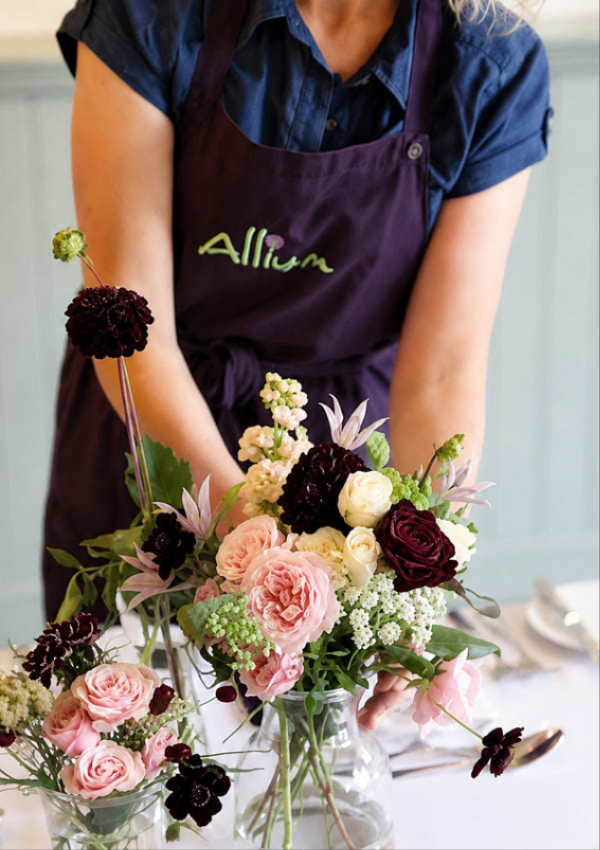 Bride holding a handcrafted Allium wedding bouquet