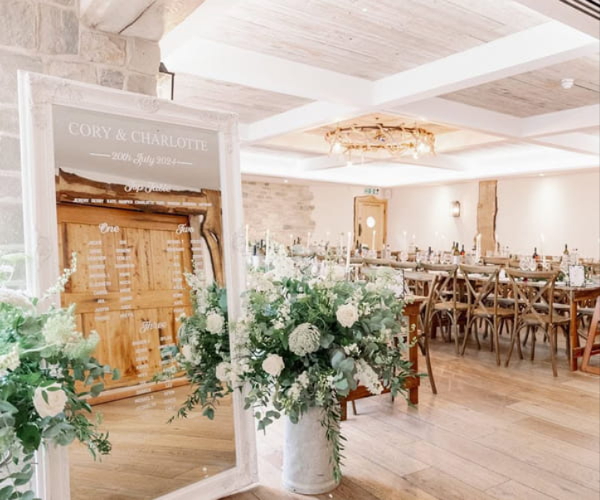 Wedding table flowers and venue arrangements by Allium