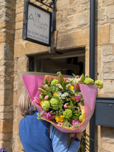 Summer Celebration - A vibrant handcrafted bouquet featuring cheerful pink, yellow and green tones, beautifully arranged with seasonal flowers and fresh foliage.