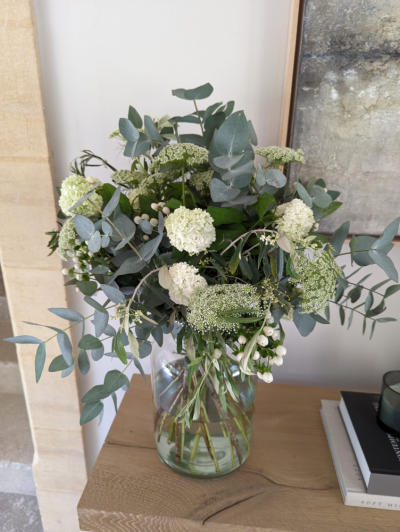 White Whisper Vase - A natural vase arrangement of fresh white seasonal flowers and lush foliage, beautifully styled for a timeless and elegant display.