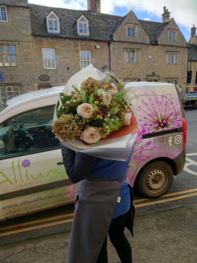 Rustic Rose Bouquet - A beautifully handcrafted bouquet in soft ivory, green and dusky pink tones, expertly arranged with seasonal flowers and fresh foliage.